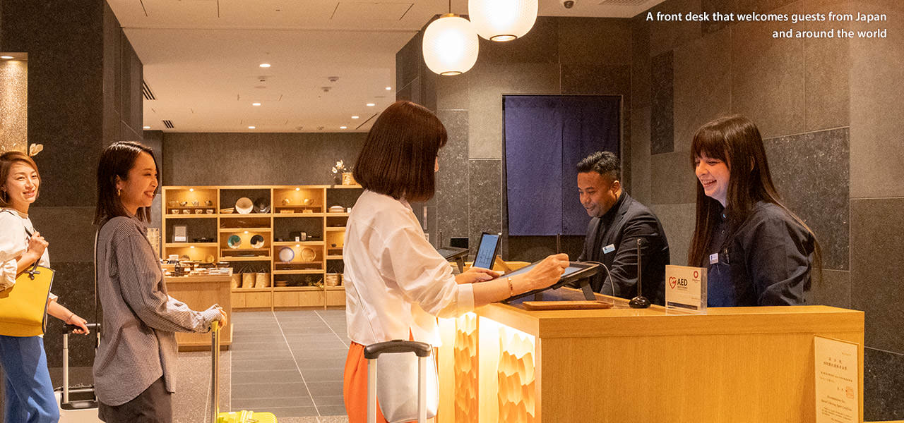 A front desk that welcomes guests from Japan and around the world